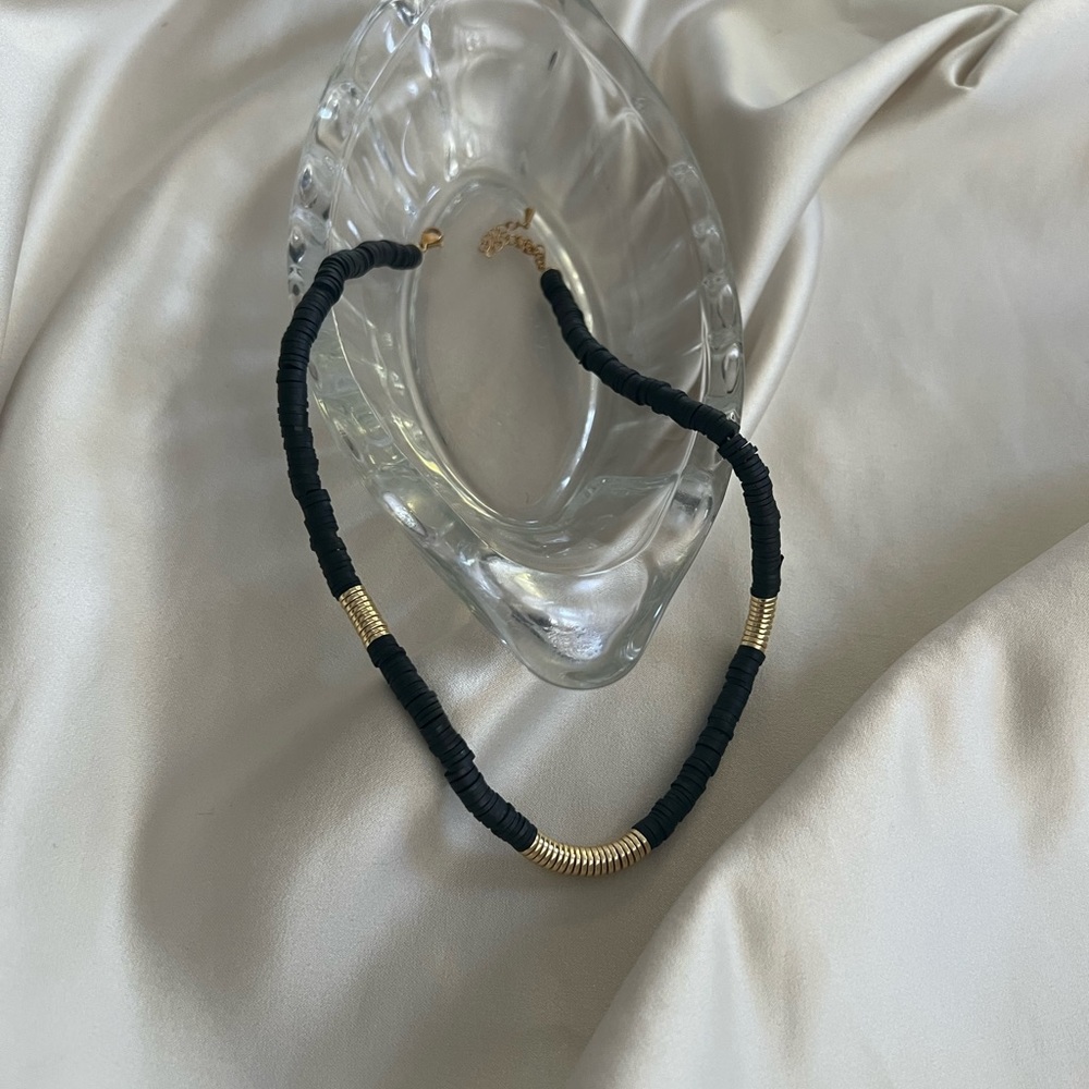 Unique hand-crafted disc/ bead style Necklace with gold plated  barrel clasp.